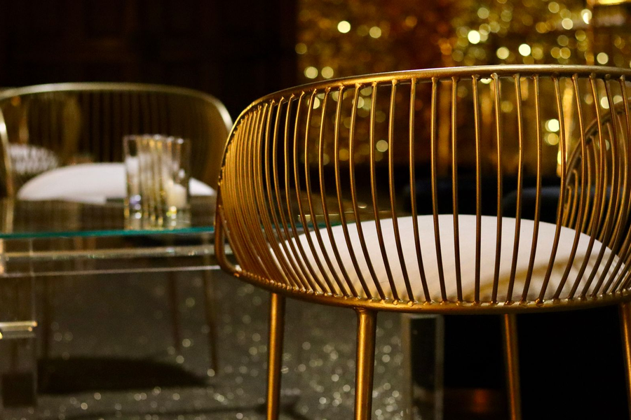 Luxurious VIP lounge interior in dark and gold tones