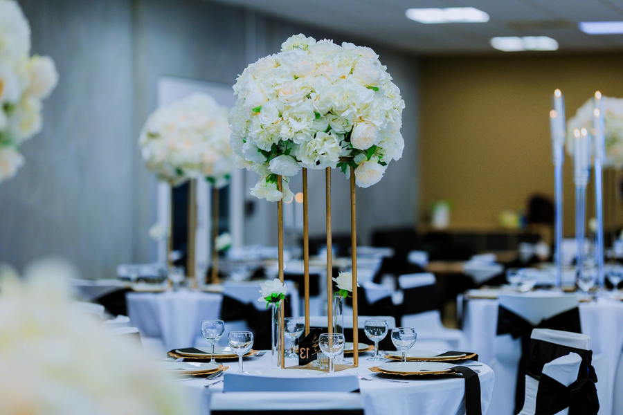 Black-tie guests at a grand ballroom gala