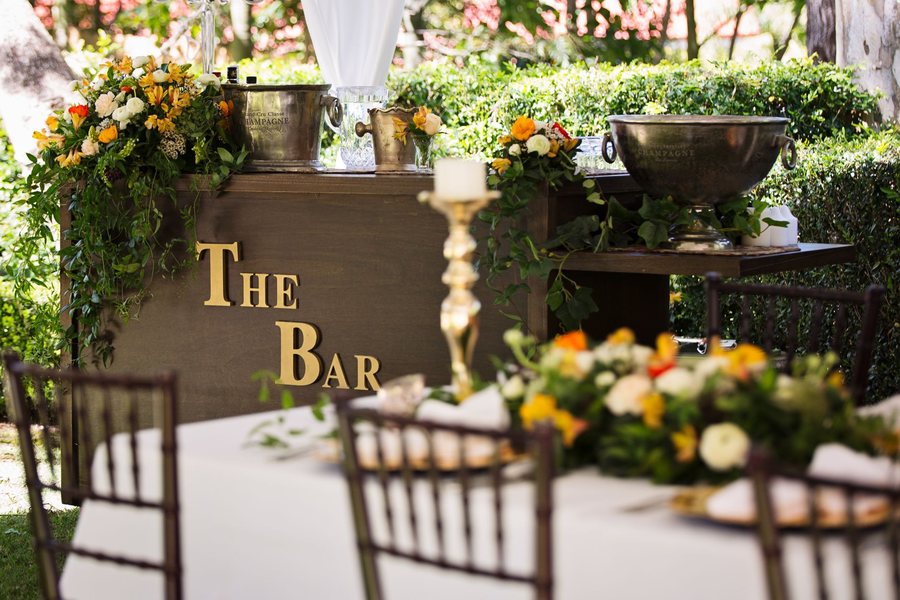 Garden party table with flowers and champagne