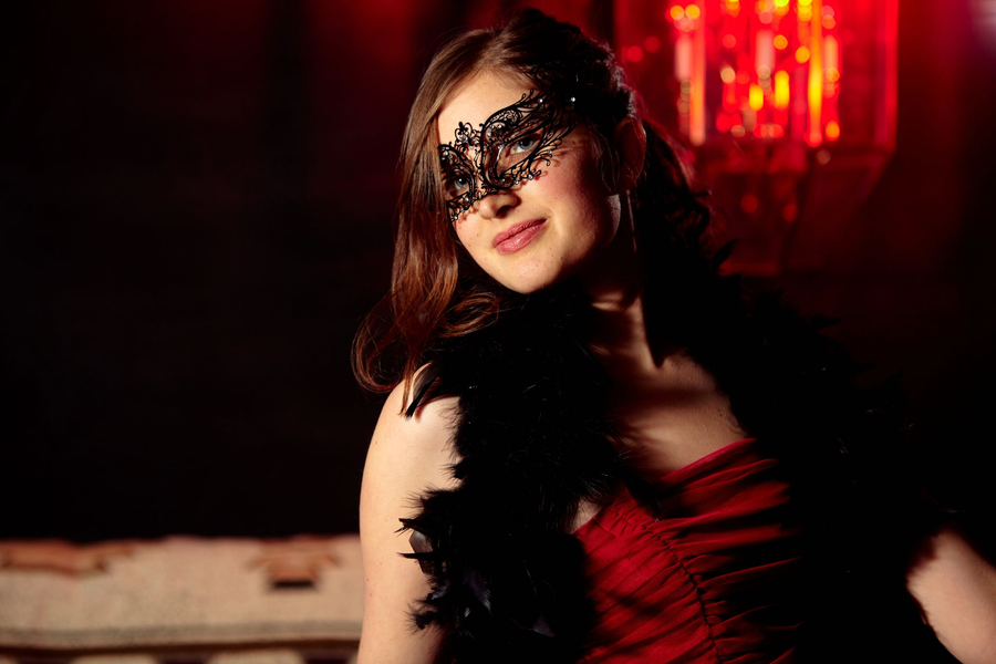 Elegant masquerade mask against evening lights