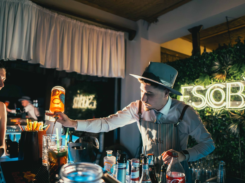 Bartender preparing cocktails at the evening bar